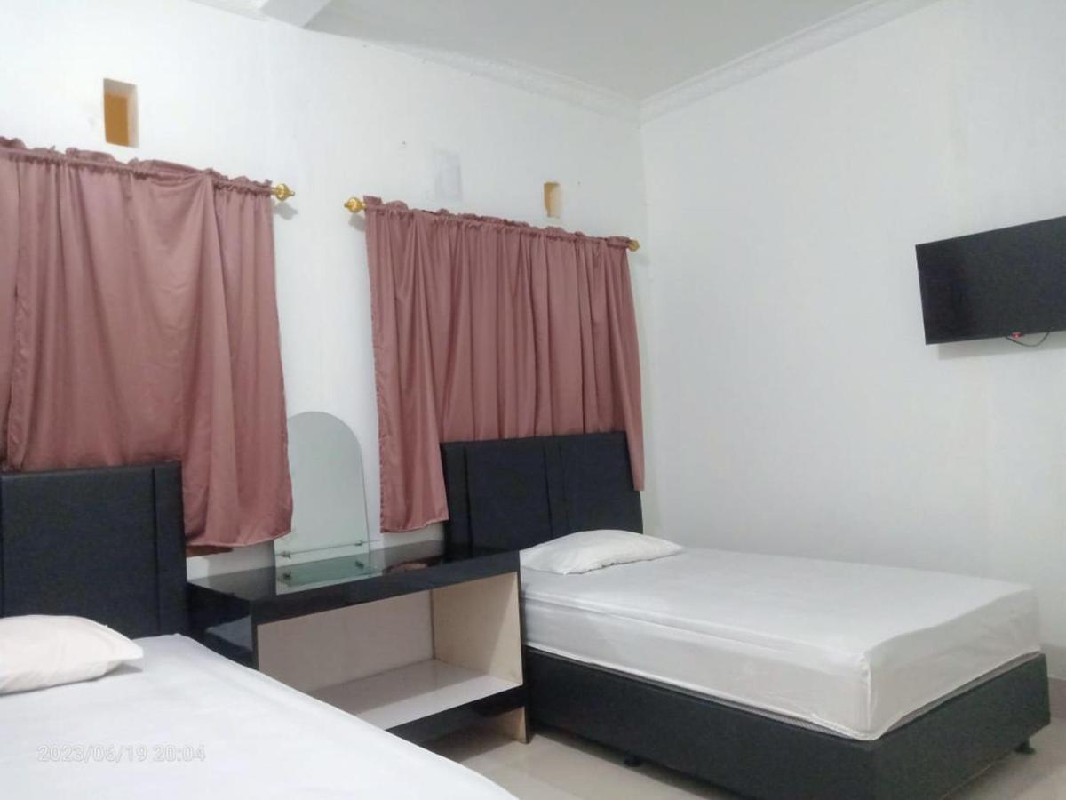 Permata Homestay Kotamobagu Mitra Reddoorz Buitenkant foto